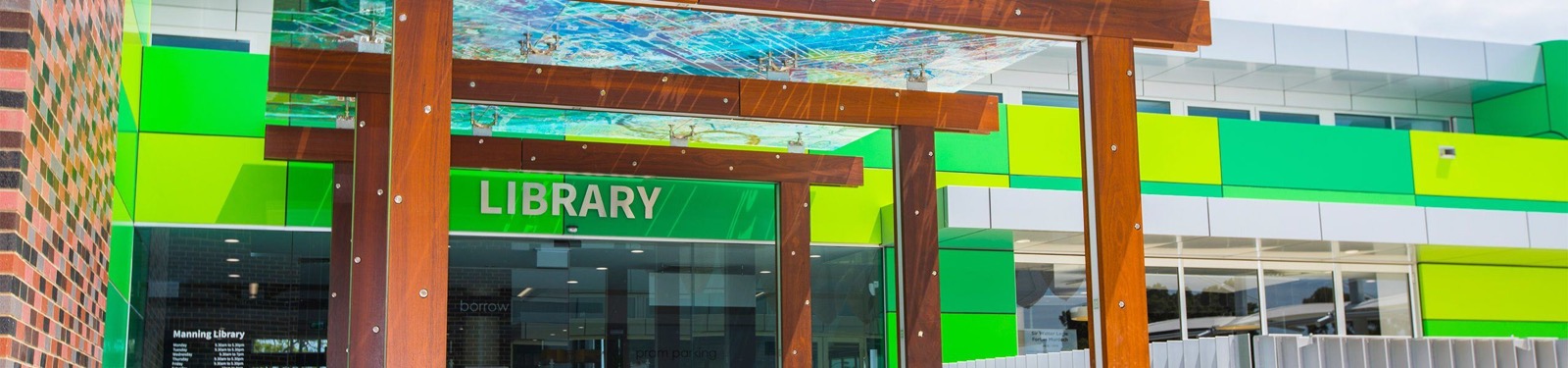 library entrance featuring work by denmac